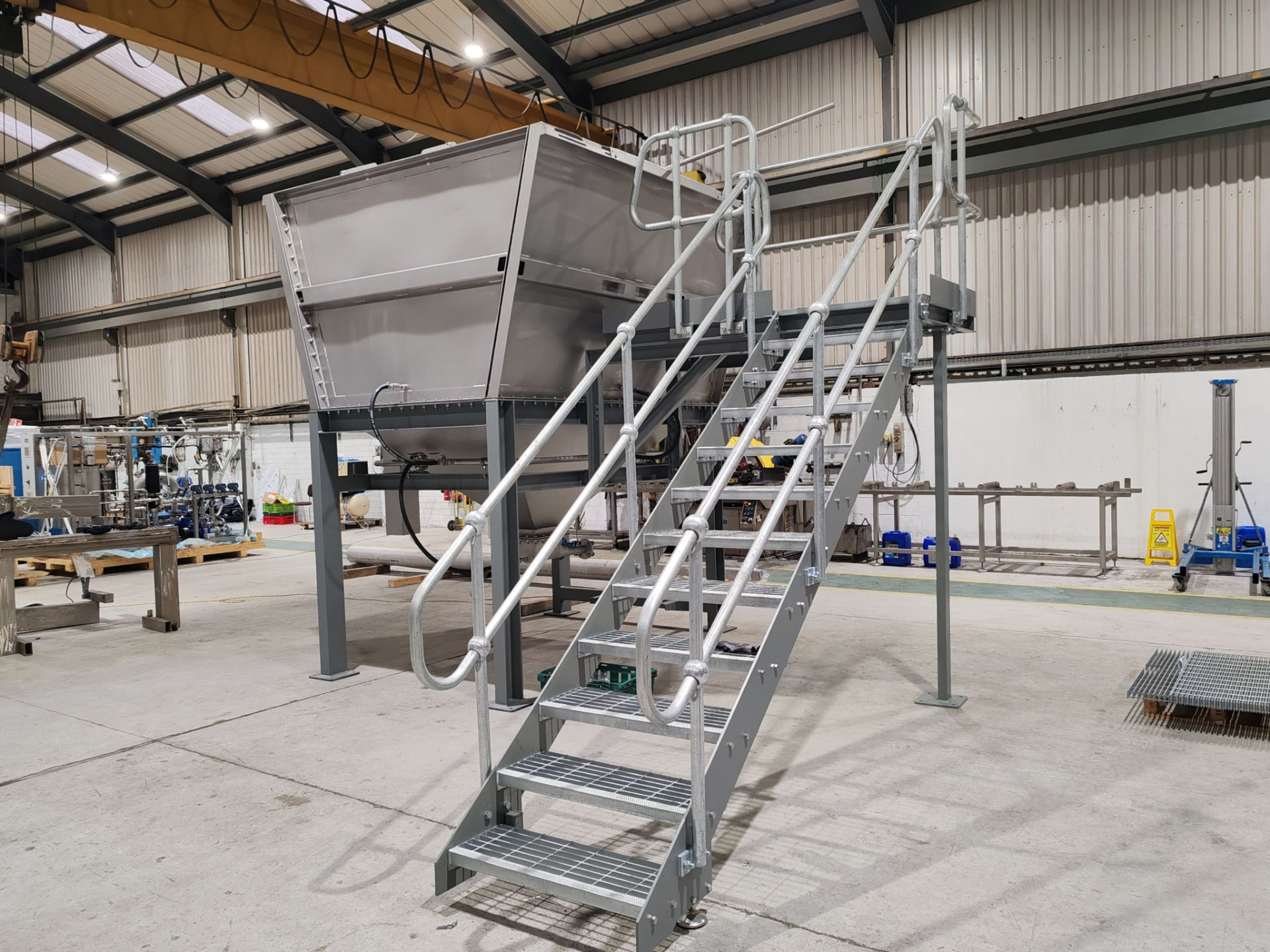 Mild steel hopper support structure with galvanised staircase and handrails